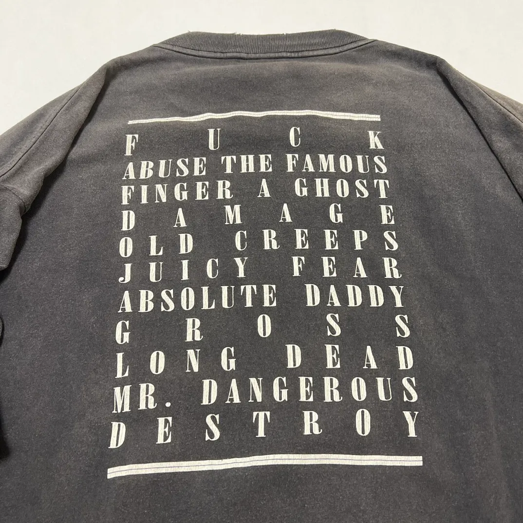 SAINT Mxxxxxx LS TEE/TEMPEST/BLK 'TEMPEST SAINT' Storm Religious Saints Cracked Retro Vulcanized Heavy Wash Long Sleeves Washed Black S-XL Assute Dyeing Multi-bit Horse Fading Craftsmanship Grinding and Hanging Holes Full of Old Feeling Top Printing Craftsmanship Purchasing Level